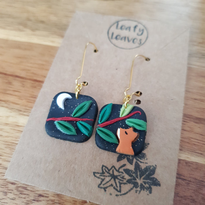 Small midnight sky asymmetrical earrings with foxes and leaves / nature woodlands and forest