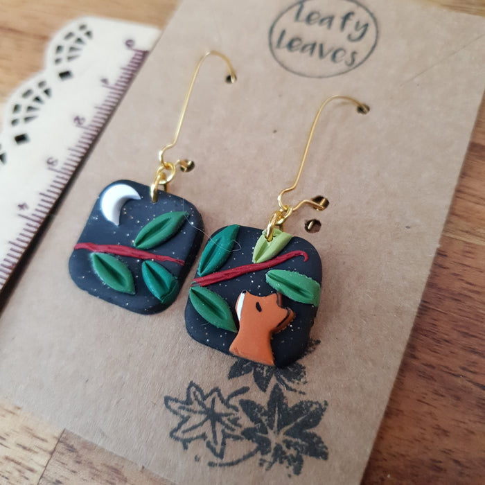 Small midnight sky asymmetrical earrings with foxes and leaves / nature woodlands and forest
