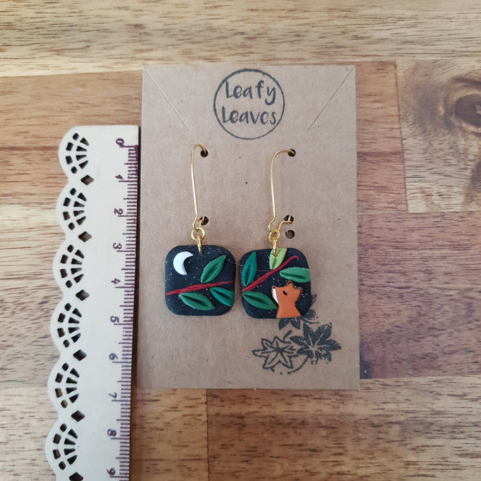 Small midnight sky asymmetrical earrings with foxes and leaves / nature woodlands and forest