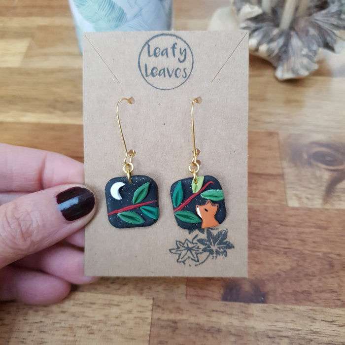 Small midnight sky asymmetrical earrings with foxes and leaves / nature woodlands and forest
