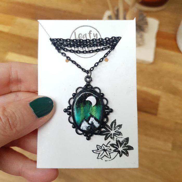 Northern lights mountains scene black necklace cabochon / handmade from polymer clay / nature jewelry pendant